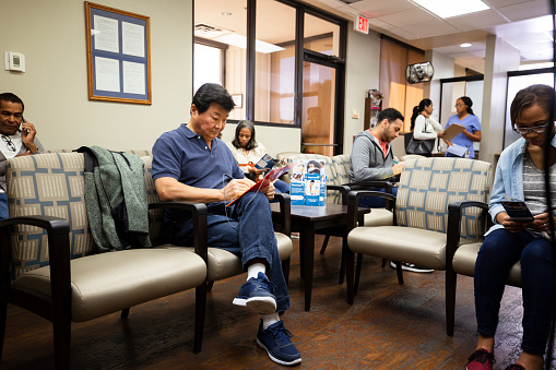 Many people wait in the busy day surgery waiting room.
