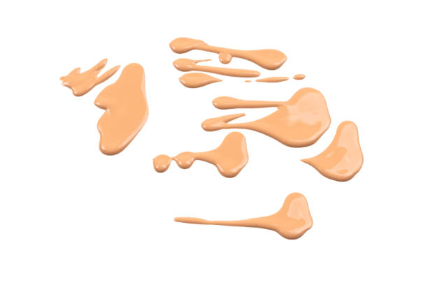 istock Liquid foundation swatch isolated on white background. Close Up of makeup cream sample. 1208597272