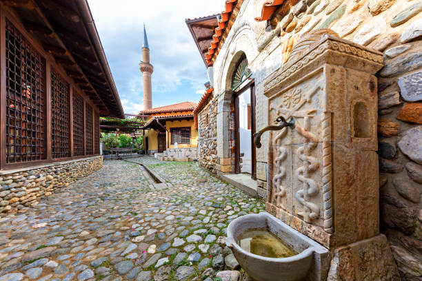 Marble fountain and minaret in Prizren, Kosovo Old fountain with the minaret of Halveti’s Tekke Mosque in the background, Prizren, Kosovo kosovo stock pictures, royalty-free photos & images