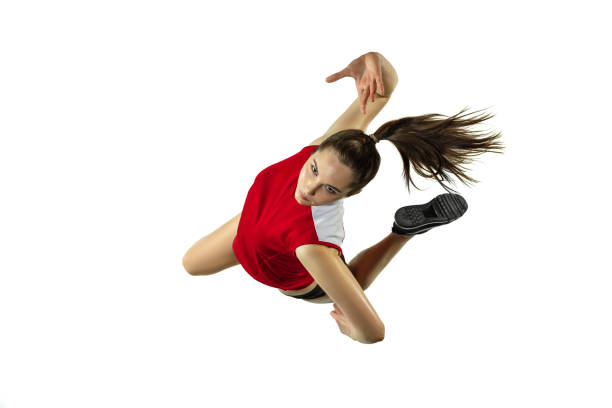 istock Young female volleyball player isolated on white studio background in flight and motion 1208598030