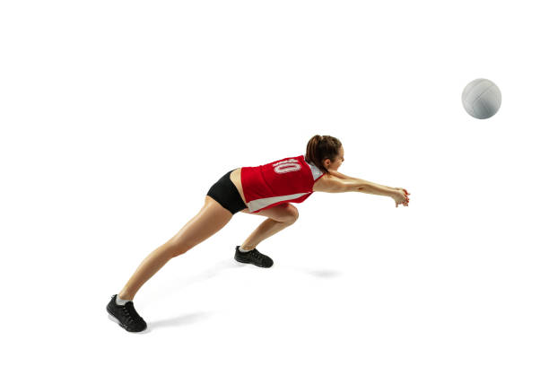 istock Young female volleyball player isolated on white studio background in flight and motion 1208598091