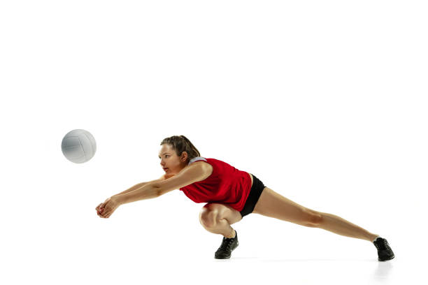 istock Young female volleyball player isolated on white studio background in flight and motion 1208598130