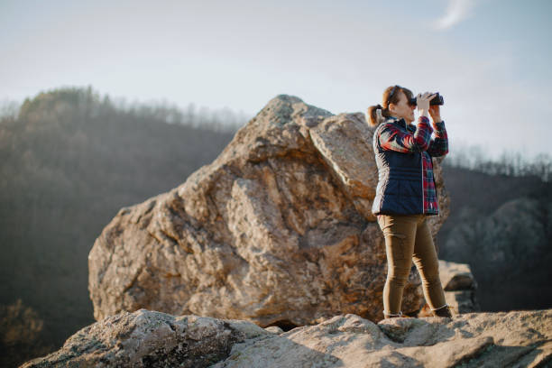 istock Senior Woman On using Binoculars to watch birds 1208598421