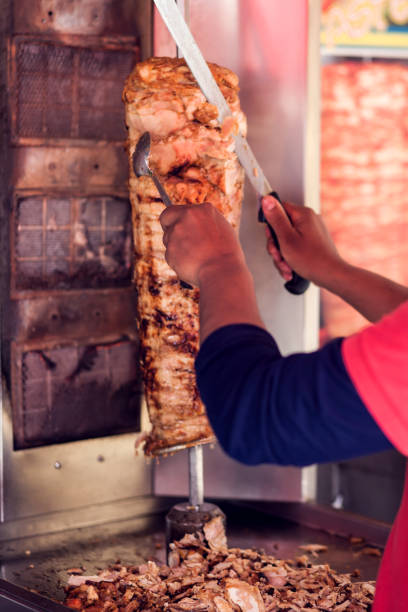 istock A cook cutting kebab meat with knife 1208599564
