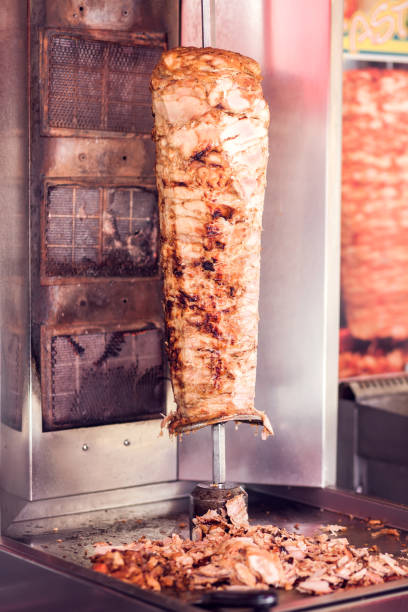 istock A cook cutting kebab meat with knife 1208599573