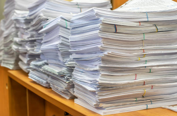 pile of paper documents in the office stock photo