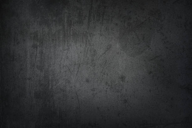 istock Black grungy faded stucco, concrete and cement pattern, Textured Background. 1208601850