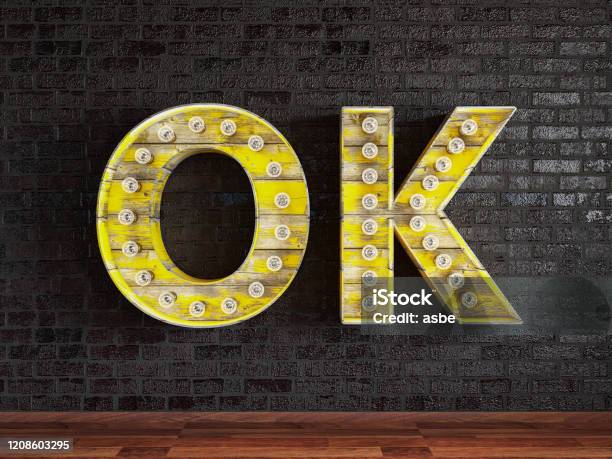 Ok Light Bulb Sing On Black Brick Wall Stock Photo - Download Image Now - Logo, Neon Lighting, Choosing
