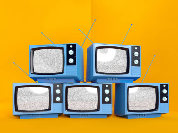 istock Pile of Five Old Blue TVs on Orange 1208603537