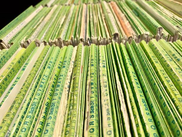 istock Rows of old medical files in file cabinet 1208603579