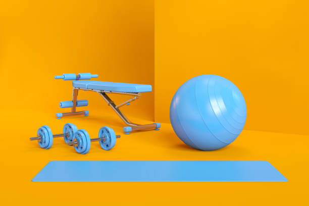 yoga bleu pilates et équipements de remise en forme sur le fond orange - yoga ball photos et images de collection
