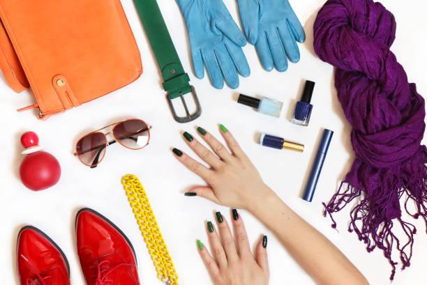istock Rainbow design of colored accessories, decorative cosmetics and green saturated manicure 1208604290