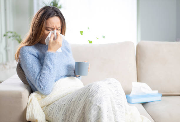 istock Young woman suffering from cold 1208604578