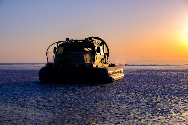Rescue hovercraft boat on the surface of frozen lake stock photo