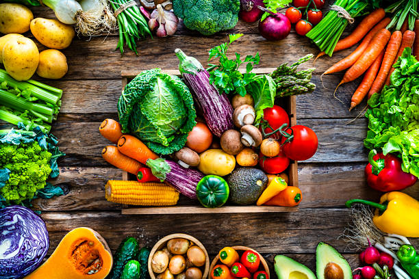 istock Healthy fresh vegetables on rustic wooden table. 1208606422