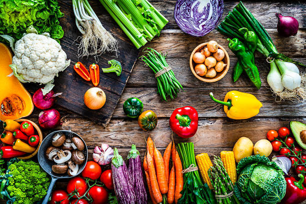 istock Healthy fresh organic vegetables shot from above on rustic kitchen table. 1208606646