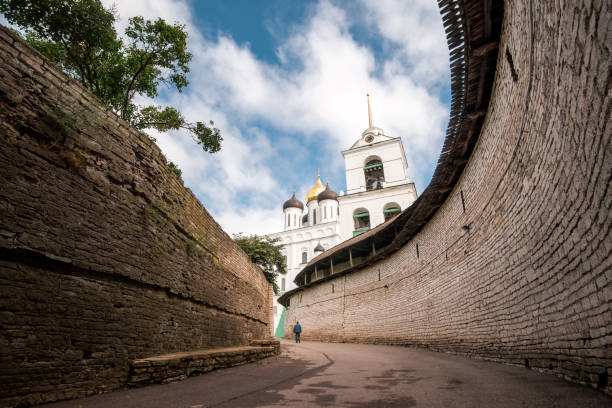 Inside Pskov Kremlin. Ancient Russian architecture. Stone walls corridor.