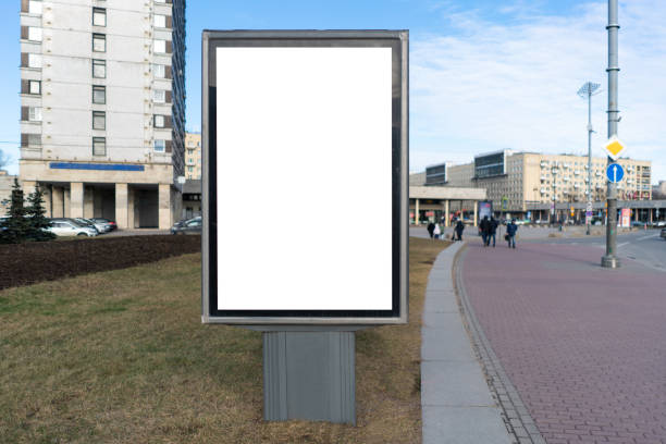 istock Vertical billboard, small city format. near the footpath. With white space for mock-up posters 1208610166