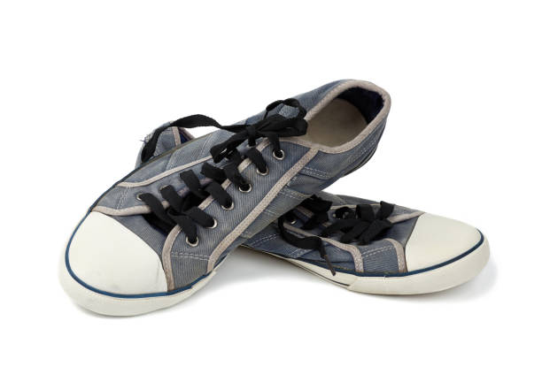 istock pair of blue worn textile sneakers with black laces 1208614453