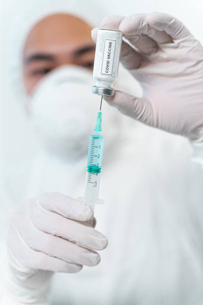 istock Attentive medical worker going to test COVID vaccine 1208614743