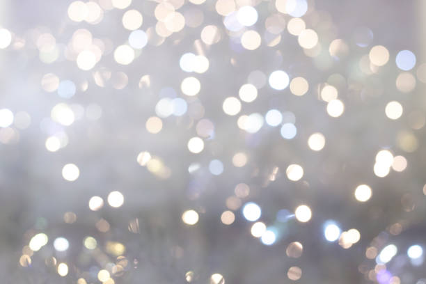 istock Defocused lights and sparkles on a silver gray background. Festive background concept. Copy space 1208615925