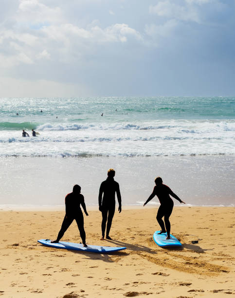 istock Surfing school lessons beach Portugal 1208616187