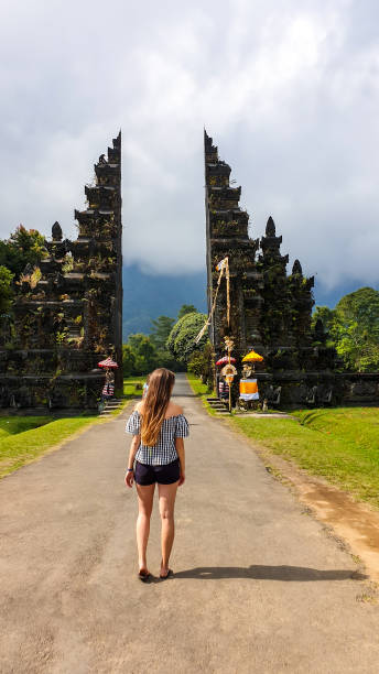 istock Buleleng - A girl standing in front of Bali Handara Gate 1208617652
