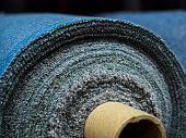A roll of denim fabric. Woven factory or warehouse
