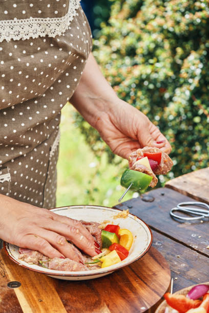 istock Preparing Lamb Kebab Outside in the Garden 1208620426