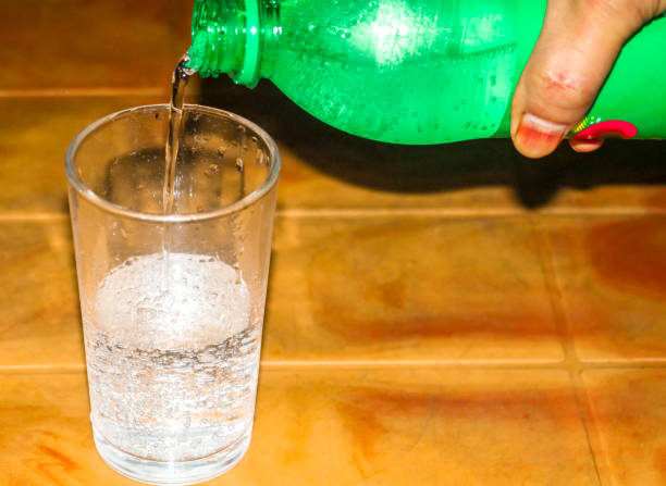 istock Soft drink putting in the glass 1208621376