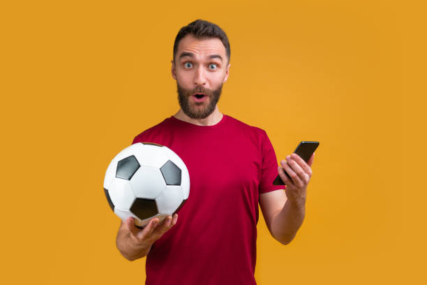 istock Young attractive bearded man betting at bookmaker's website 1208621747