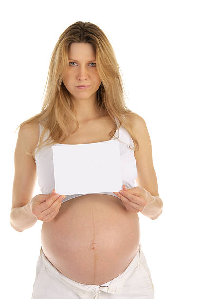 istock Dissatisfied  pregnant woman with a blank form 120862177