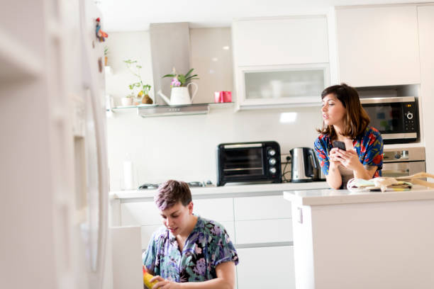 istock Lesbian couple making a shopping list on a smartphone 1208621993