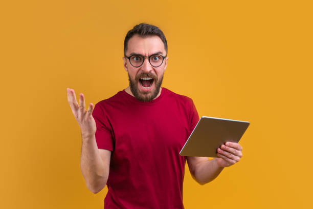 istock Young attractive bearded man betting at bookmaker's website 1208622074