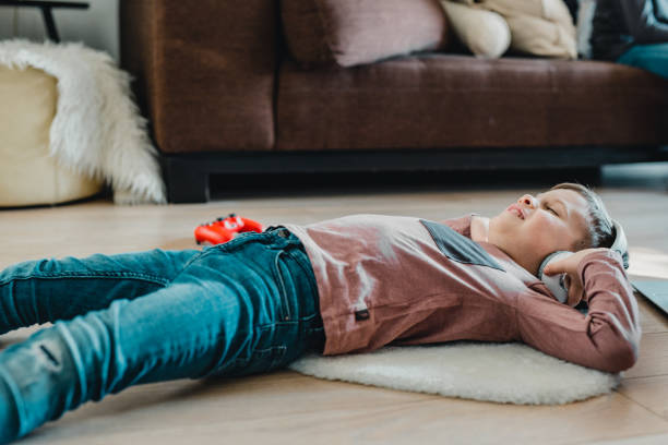 istock Photo of young boy with technology 1208623433