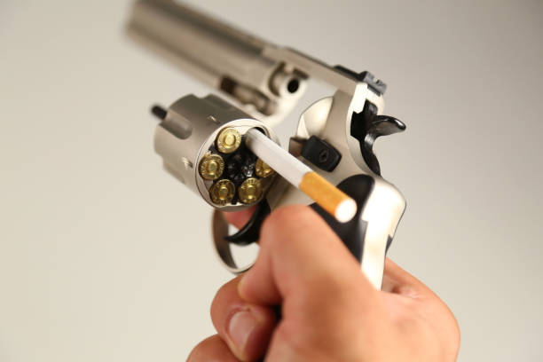 pistol and bullets on white background. smoking kills. - addiction ammunition weapon army imagens e fotografias de stock