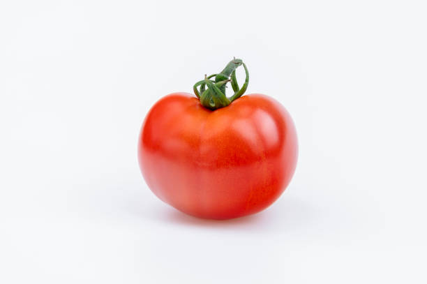 istock Whole fresh red tomato isolated on white background 1208630974