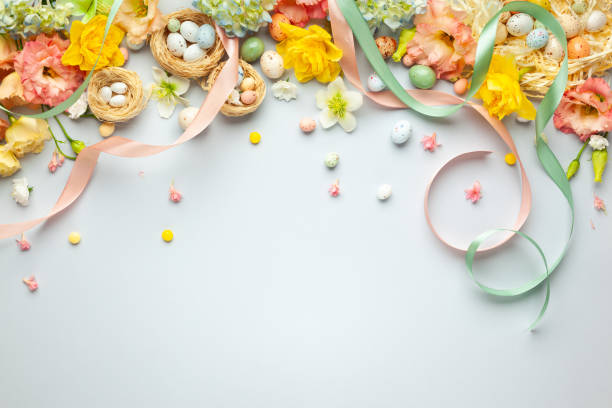 istock Happy Easter concept with easter eggs in nest and spring flowers. 1208631018