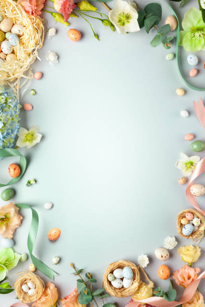 Happy Easter concept with easter eggs in nest and spring flowers. Happy Easter concept with easter eggs in nest and spring flowers. Easter background with copy space. Flat lay. egg food photos stock pictures, royalty-free photos & images
