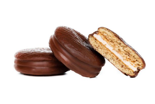 istock Choco pie on a white background. Chocolate covered mini cakes close-up. 1208631387