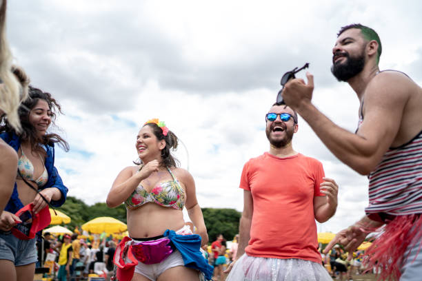 istock Group friends dancing at street carnival party 1208631461
