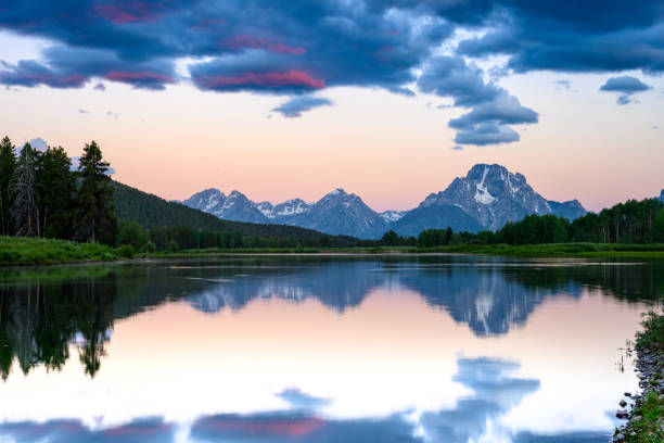 istock Clouds and Sunrise Skies Linger Over Grand Teton 1208632074