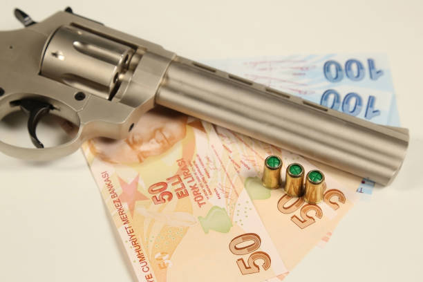 istock Turkish Liras, Gun and, Bullets on Table 1208633734