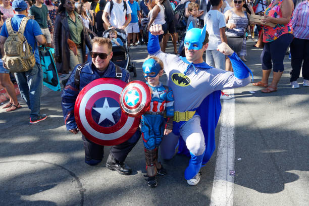 People wearing costumes, taking photos in the street next to the San Diego Comic-Con International People wearing costumes, taking photos in the street next to the San Diego Comic-Con International, Comic book convention in San Diego, California, United States. July 23rd, 2019 action anime movies stock pictures, royalty-free photos & images
