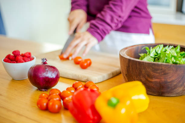 Woman preparing salad at home