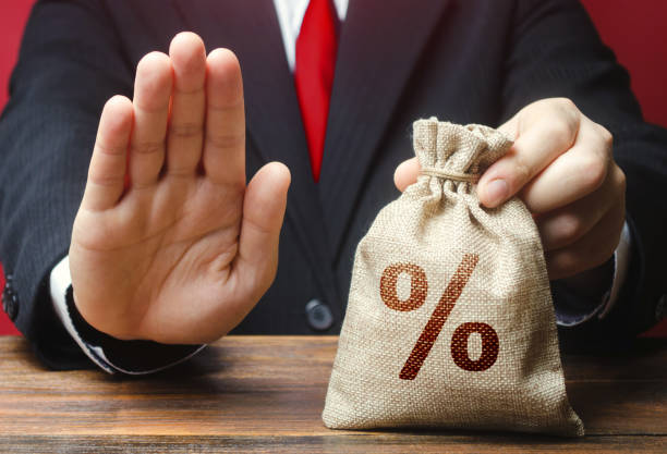 istock A man refuses to give a loan credit money bag. Financial difficulties. Refuses cooperate. Sanctions, confiscation funds. Asset freeze seizure. Refusal to grant loan mortgage, bad credit history. 1208636124