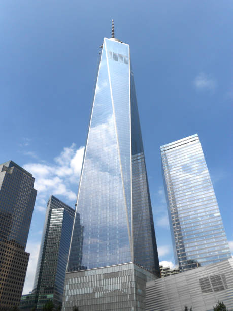 One World Trade Center in Manhattan Skyscrapers in World Trade Center reflecting the clouds in its windows liberty tower stock pictures, royalty-free photos & images