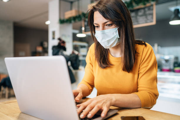 istock Woman with face protective mask 1208637840