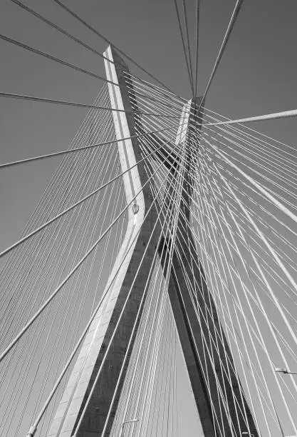 Detail of the Octavio Frias de Oliveira bridge is a cable-stayed bridge in Sao Paulo over the Pinheiros River in black and white.