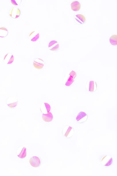 Pearl confetti on white background.